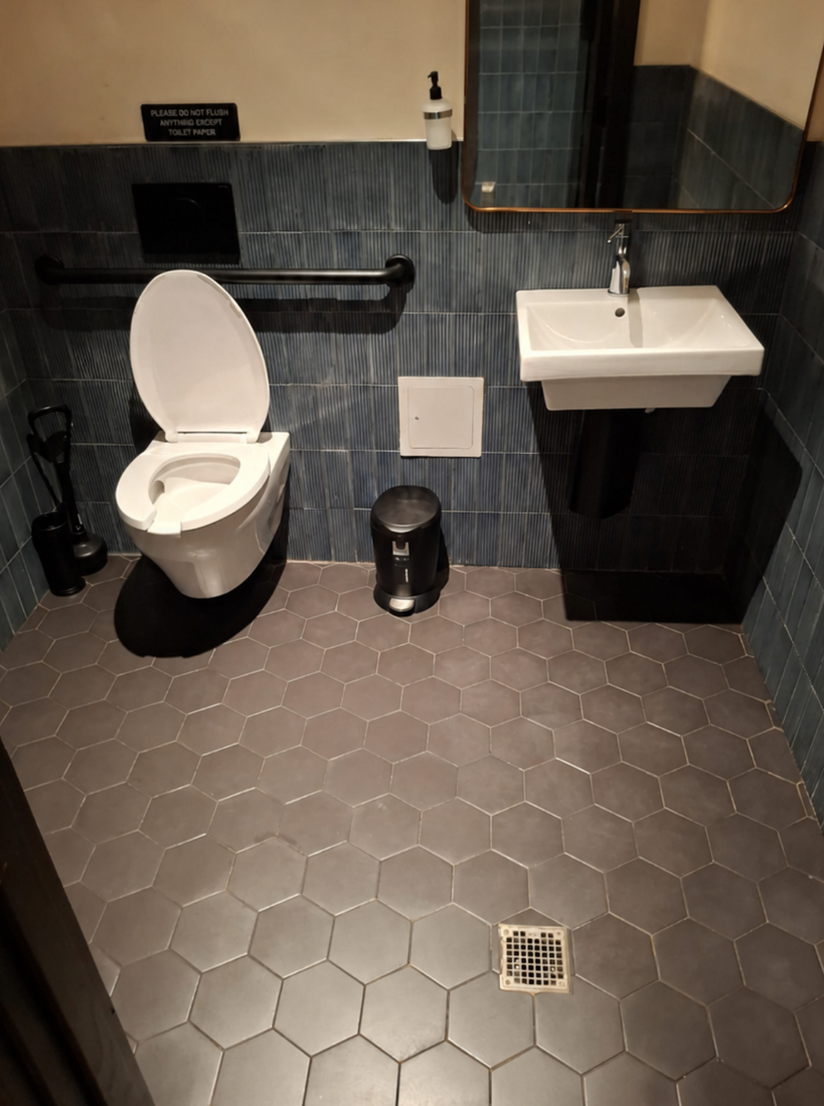 Restaurant restroom with sanitized fixtures and streak-free surfaces — Ledian's Cleaning Services