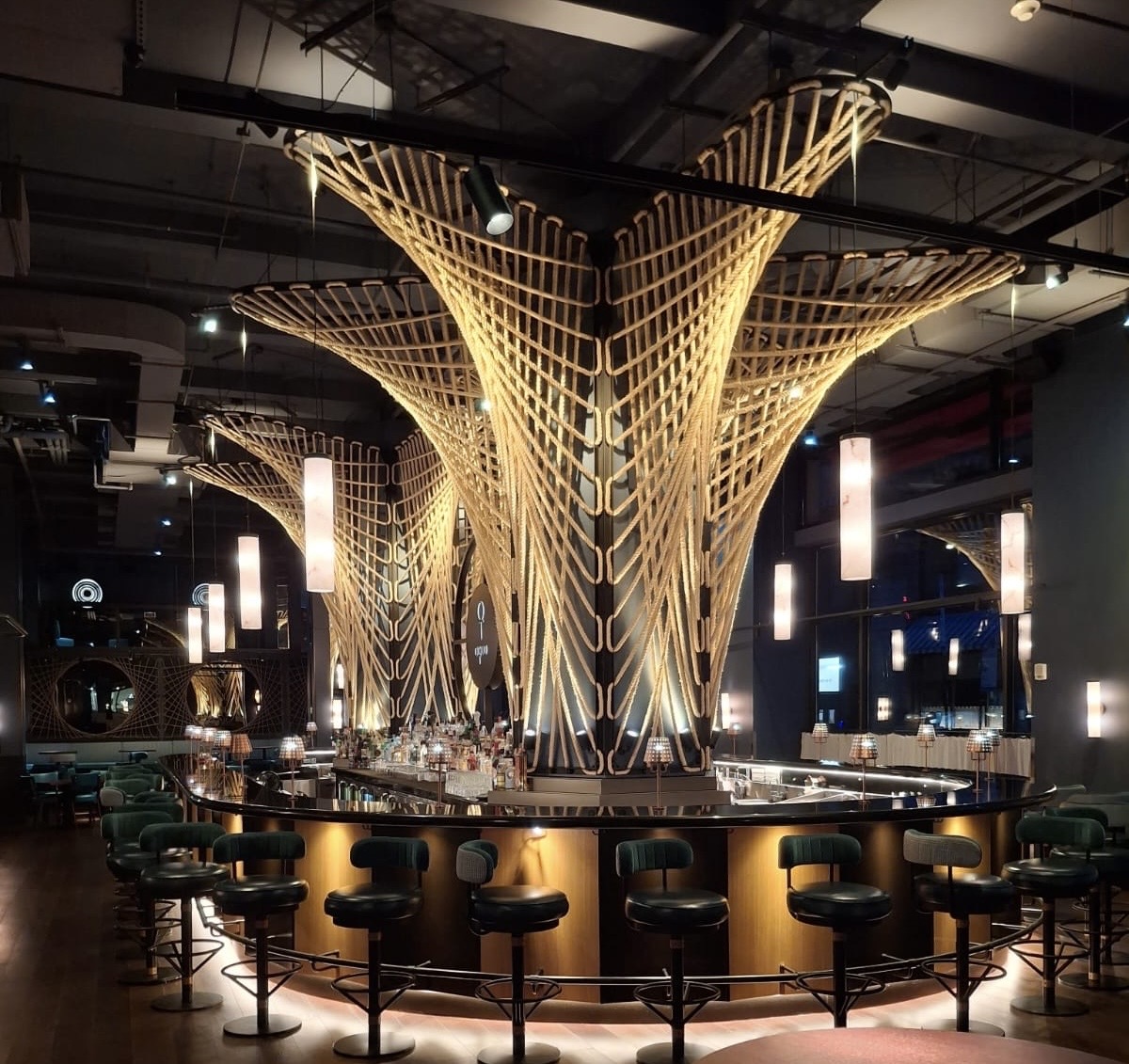 Upscale round bar with rope sculpture ceiling, polished bar top and clean bar stools — Ledian's Cleaning Services
