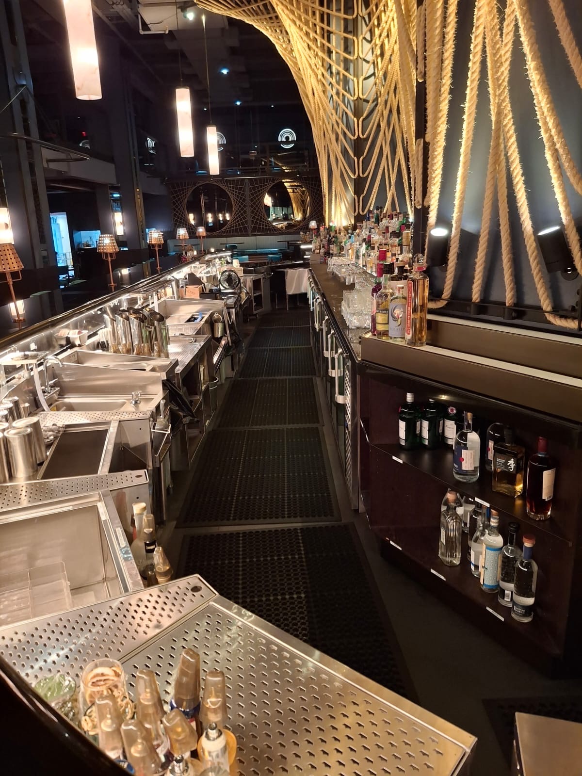 Clean bar counter with polished glassware and spotless back bar — Ledian's Cleaning Services