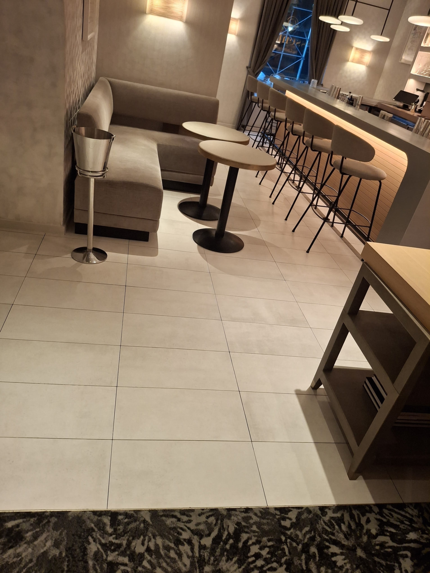 Detail of a sanitized bar surface and speed rail after cleaning — Ledian's Cleaning Services